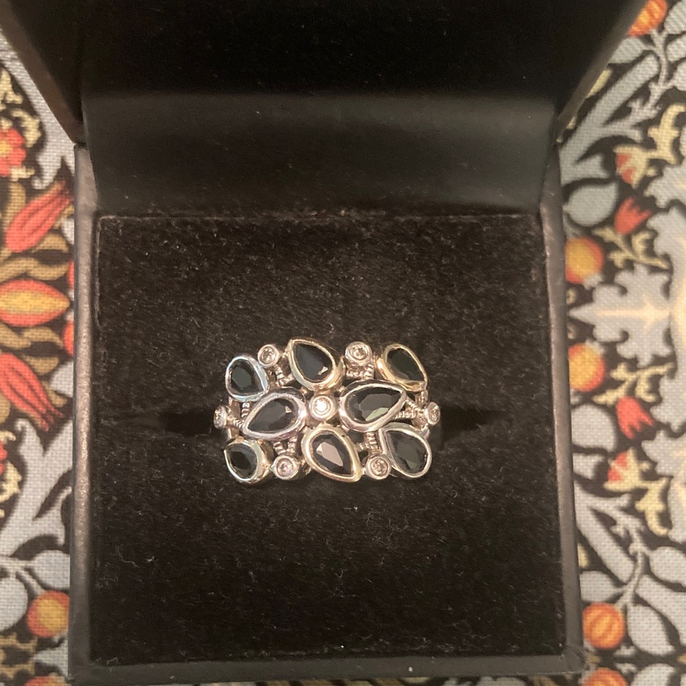 Sterling silver and sapphire ring with diamond accents rimmed in 14ct gold, sz 6